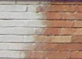 Paint stripping off brickwork